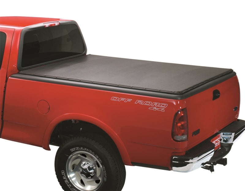 Lund 01-04 Nissan Frontier (5.5ft. Bed w/o Factory Bedliner) Genesis Snap Tonneau Cover - Black